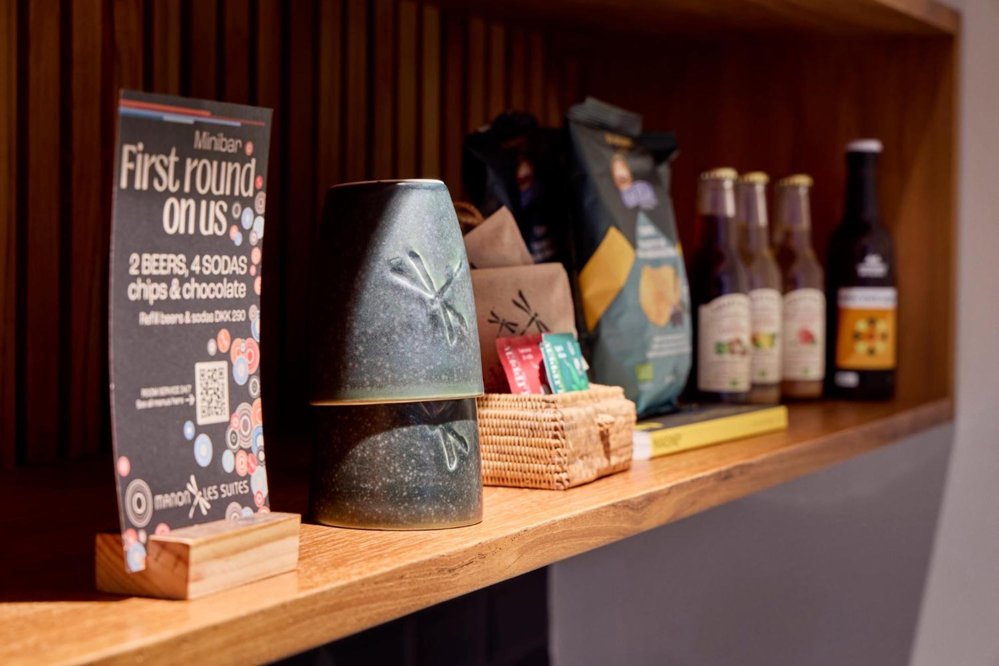 玛农勒斯套房古斯米登酒店 哥本哈根 外观 照片 Beer and snacks at the bar